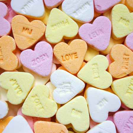 yellow pink orange and white loves heart candies